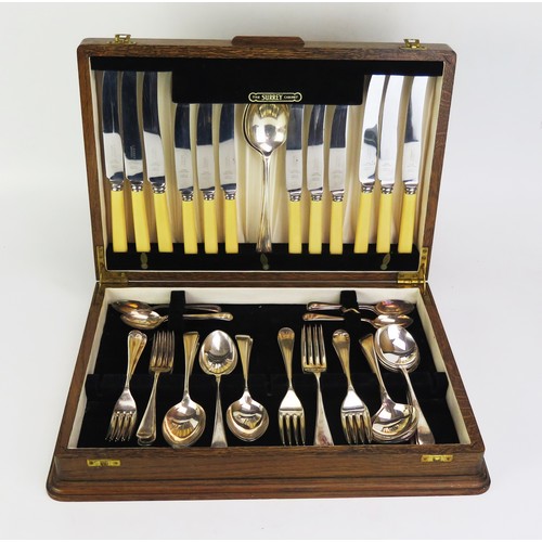 699 - A plated Old English pattern flatware service, with ivorine handled dinner knives and dessert knives... 