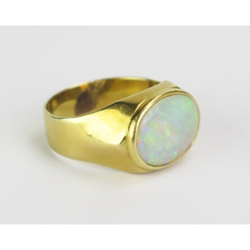 100 - An 18ct Gold and Opal Ring, c, 14x10.5mm stone, stamped 18K, size Q, 6.2g gross