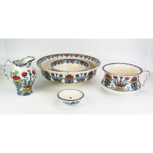 1007 - An Art Nouveau influence Staffordshire pottery five-piece toiletry set, with polychrome floral trans... 