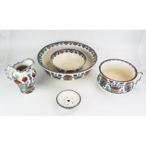 1007 - An Art Nouveau influence Staffordshire pottery five-piece toiletry set, with polychrome floral trans... 