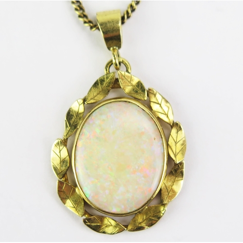 101 - An 18ct Gold and Opal Pendant, 16x12.5mm singlet stone, and on a 9ct gold chain, 15.75