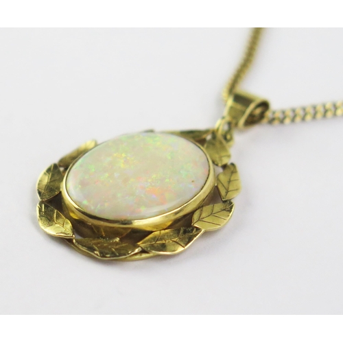 101 - An 18ct Gold and Opal Pendant, 16x12.5mm singlet stone, and on a 9ct gold chain, 15.75