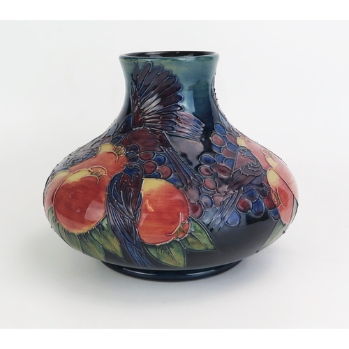 1017 - A Moorcroft pottery vase, of squat globular form, decorated in the 'Finches' pattern designed by Sal... 