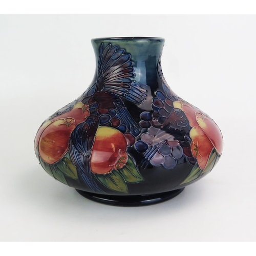 1017 - A Moorcroft pottery vase, of squat globular form, decorated in the 'Finches' pattern designed by Sal... 