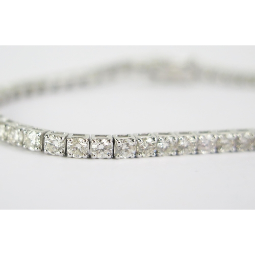 102 - An 18ct White Gold and Diamond Tennis or Line Bracelet, stamped 18K, 5.11ct of diamonds, 7