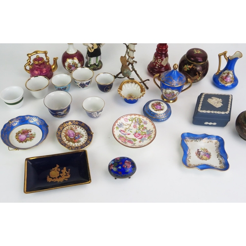 1023 - A collection of  assorted ceramics including Limoges miniature plates, cabinet vases, boxes and cove... 