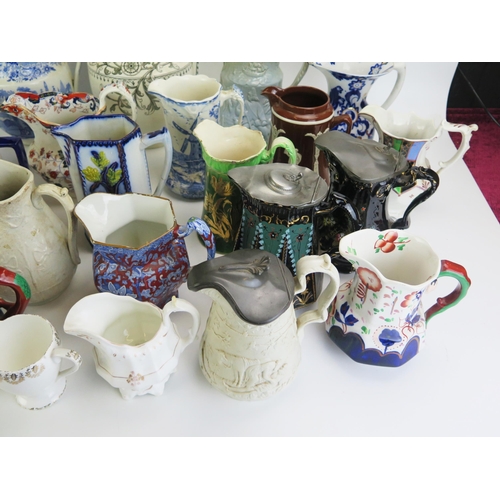 1024 - A collection of assorted Victorian and later jugs, including moulded cordial jugs, milk and water ju... 