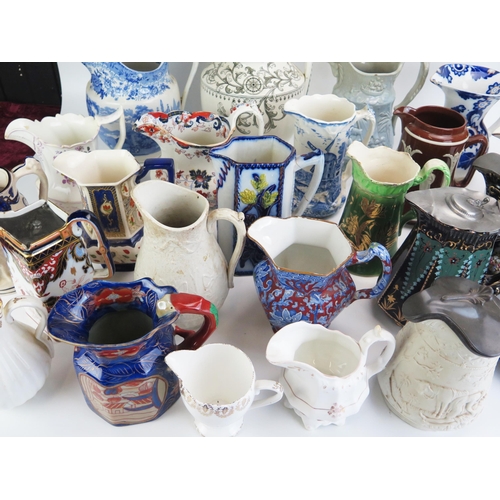 1024 - A collection of assorted Victorian and later jugs, including moulded cordial jugs, milk and water ju... 