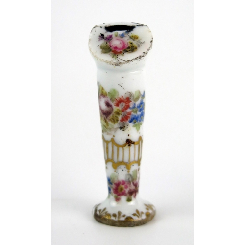 1036 - A Meissen porcelain whistle with floral decoration heightened in gilt, bears underglaze blue crossed... 