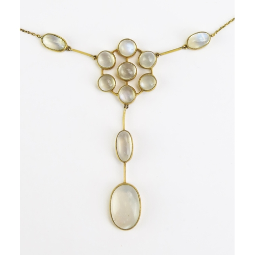 104 - An Antique Large 9ct Gold and Moonstone Necklace with integral chain, panel stamped 9CT, overall len... 