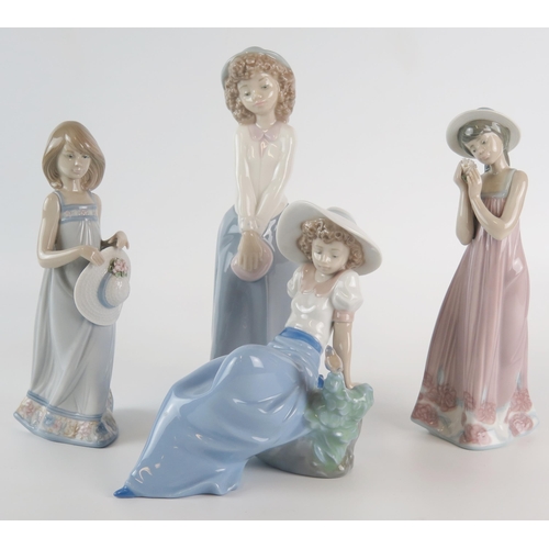 1056 - Lladro and Nao, four assorted porcelain figurines of young girls including seated girl with bird. (4... 