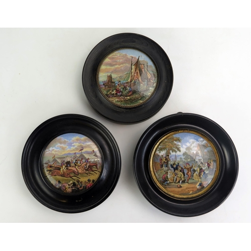 1058 - Three Prattware pot lids, 'The Village Wedding', 'Derby Day' and 'Mending the Nets' all in ebonised ... 