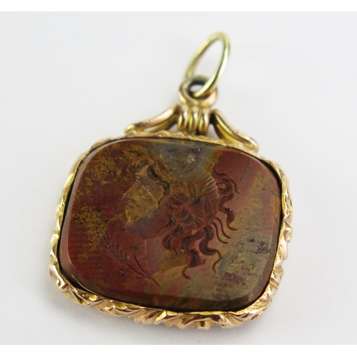 110 - A Specimen Stone Intaglio Fob in Yellow Precious Metal Setting, decorated with a bust in profile, (2... 