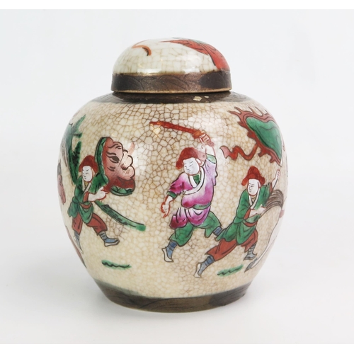 1104 - A late 19th century Chinese crackle glaze ginger jar and cover, decorated with warriors, 15cm high.