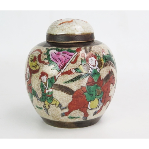 1104 - A late 19th century Chinese crackle glaze ginger jar and cover, decorated with warriors, 15cm high.