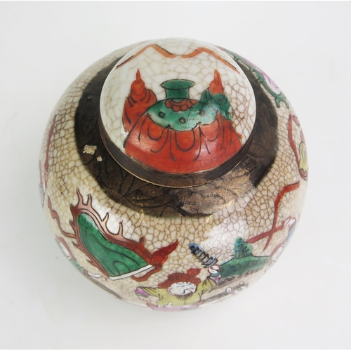 1104 - A late 19th century Chinese crackle glaze ginger jar and cover, decorated with warriors, 15cm high.