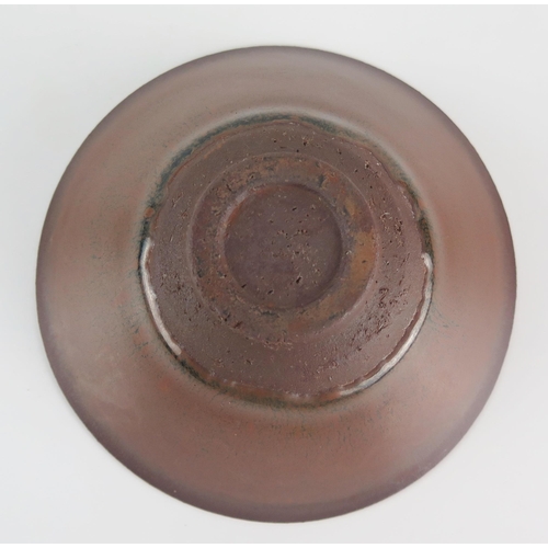 1116 - A Chinese provincial bowl with plain iron brown glaze on a circular foot, 11.5cm diameter.