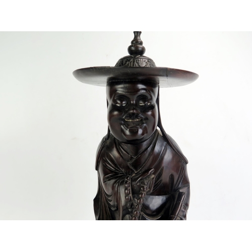 1124 - A Chinese root wood carving of an immortal possibly Lu Tung-pin, 41cm high.