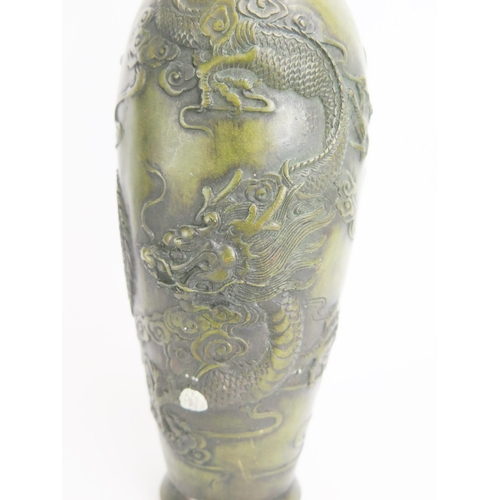 1136 - A Chinese bronze vase of ovoid form decorated with dragon and Phoenix bird amongst clouds, bears six... 