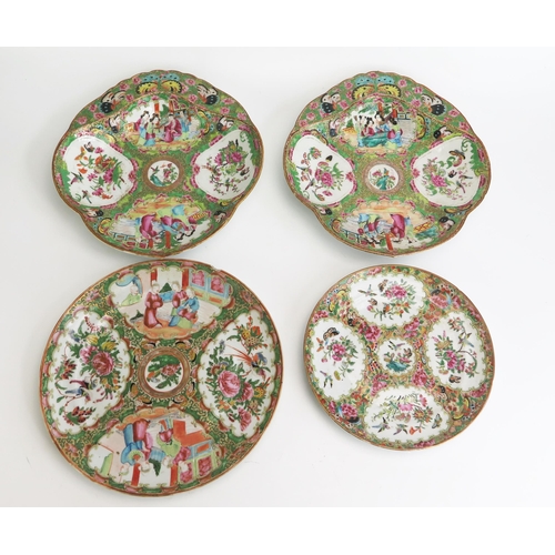 1138 - A pair of Chinese famille verte serving dishes of shell-shaped outline with panels decorated with fi... 