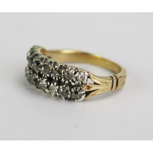 114 - A Georgian Double Row Diamond Ring in a precious yellow metal setting, old cut stones, KEE tested as... 