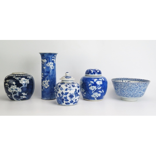 1142 - Two Chinese blue and white ginger jars with prunus decoration, a sleeve vase , bowl and jar and cove... 