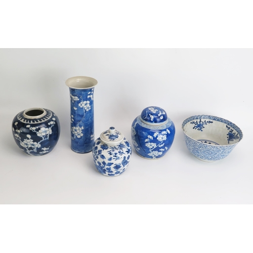 1142 - Two Chinese blue and white ginger jars with prunus decoration, a sleeve vase , bowl and jar and cove... 