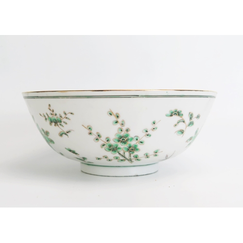 1143 - A Chinese porcelain bowl, with green floral decoration heightened in gilt, bears four character mark... 