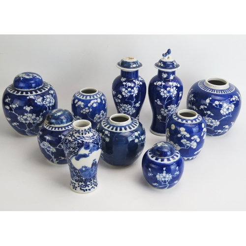 1145 - A collection of assorted Chinese prunus decorated ginger jars and covers, vase etc.