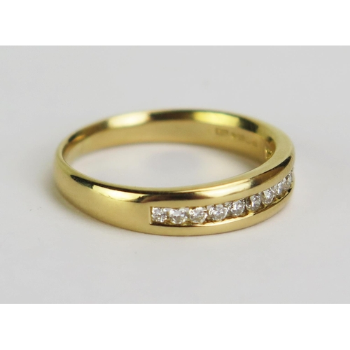 118 - An 18ct Gold and 12 Diamond Twelve Stone Channel Set Ring, hallmarked, size O.75, 4.69g