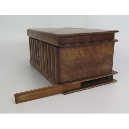 1204 - A treen jewellery box with parquetry banded decoration in the form of books, 23cm wide.