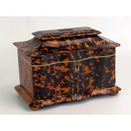 1206 - A 19th century blonde tortoiseshell  tea caddy, of serpentine outline, the domed hinged lid enclosin... 