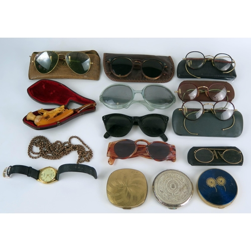 1213 - A collection  of assorted sun glasses, spectacles, powder compacts, wrist watch etc.