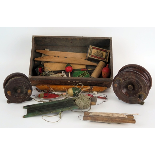 1214 - A late 19th century 3 1/2ins mahogany and brass half-starback fishing reel, a 2 1/2ins mahogany fish... 