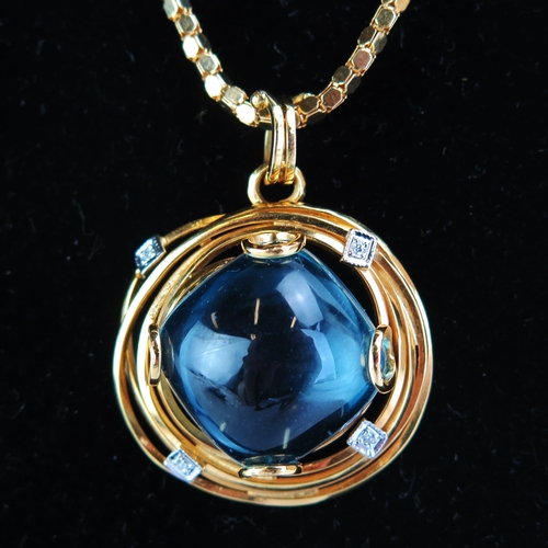 122 - An 18ct Gold, Blue Topaz and Diamond Pendant (29.5mm diam., stamped 750 and 29.13 presumably carat s... 