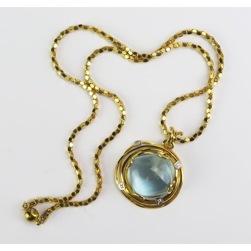 122 - An 18ct Gold, Blue Topaz and Diamond Pendant (29.5mm diam., stamped 750 and 29.13 presumably carat s... 