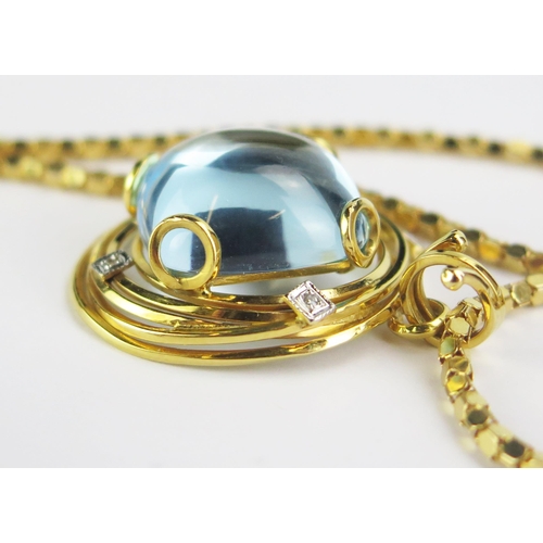 122 - An 18ct Gold, Blue Topaz and Diamond Pendant (29.5mm diam., stamped 750 and 29.13 presumably carat s... 