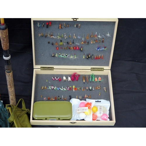 1224 - A collection of trout fishing equipment -  includes two carbon fibre rods, five centre pin reel, spa... 