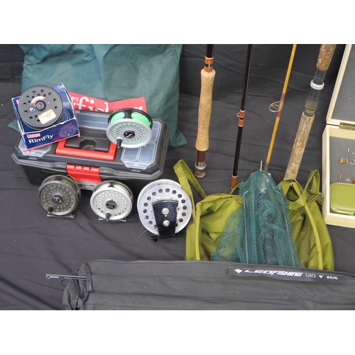 1224 - A collection of trout fishing equipment -  includes two carbon fibre rods, five centre pin reel, spa... 