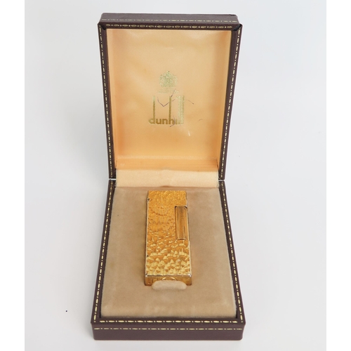 1224A - A gold plated Dunhill 70 lighter, with bark design, cased.