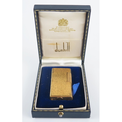 1225 - A gold plated Dunhill 70 lighter, with bark design, cased.