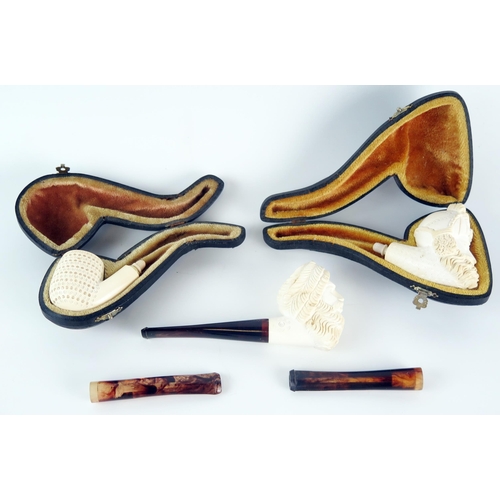 1233 - A carved meerschaum pipe in the form of a Turks head, lacks mouthpiece, cased, another similar meers... 