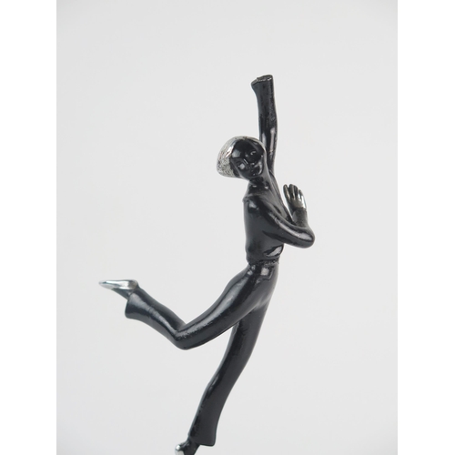 1237 - An Art Deco period figural table lighter, modelled as a dancing girl on a ball, mounted on a polishe... 