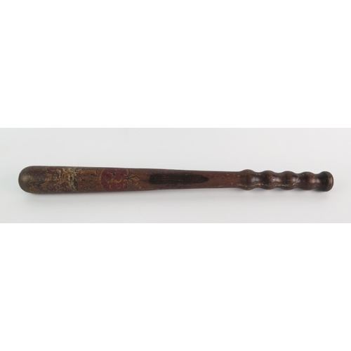 1239 - A Victorian turned wooden truncheon, with polychrome Royal cypher, 42cm long.