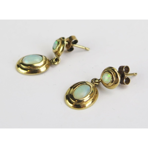 124 - A Pair of 9ct Gold and Opal Earrings, stamped 9K, 19mm drop, 1.97g gross