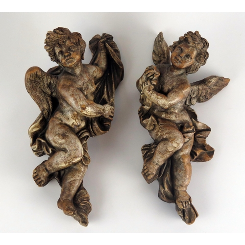 1251 - A pair of composition angels in the Rococo style, each 30 cm long.