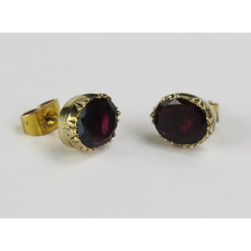 127 - A Pair of 9ct Gold and Garnet Stud Earrings, 9x7.5mm heads, stamped 9CT, 2.65g gross