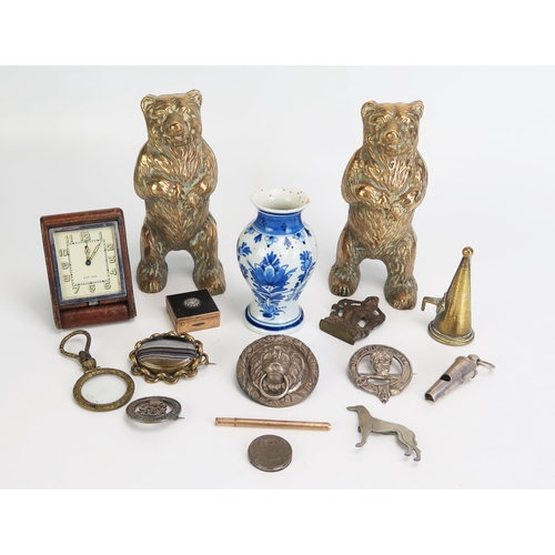 1274 - A pair of brass  model bears, banded agate brooch, Delft pottery vase, travelling timepiece, badges ... 