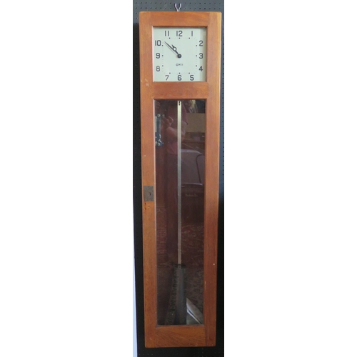 1282 - A GENTS master clock contained in an oak case, with pendulum, 127cm high