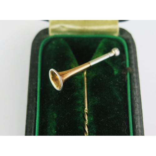 129 - A Precious Yellow Metal and Platinum Horn Pin in a contemporary box, KEE tested as 15ct, 1.59g gross